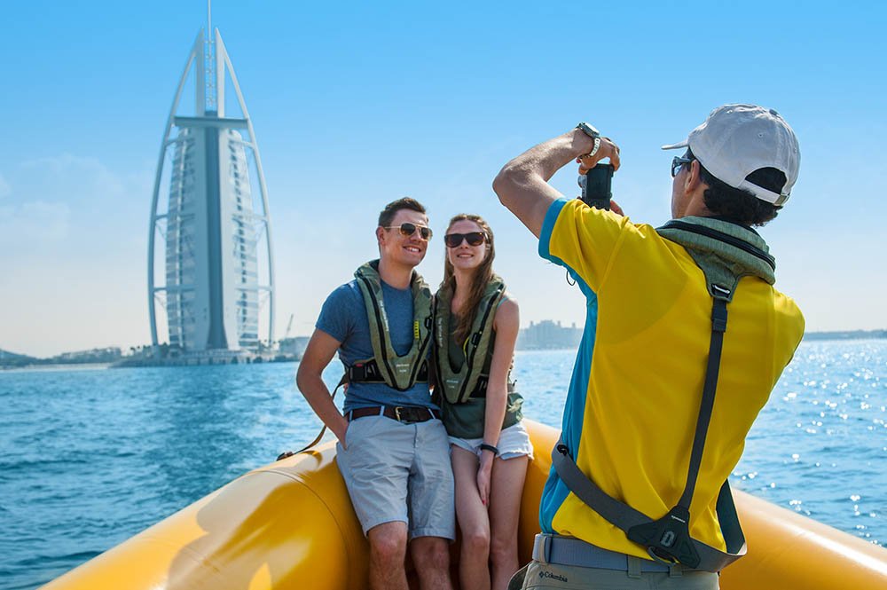 Couple enjoying the yellow boats ride in Dubai