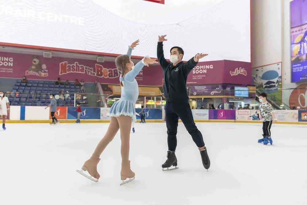 Couples skiing at Dubai Ice Rink